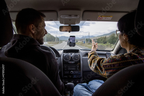 Couple traveling by car