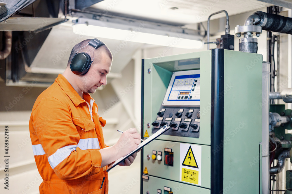 Routine work of ship engineer officer Stock Photo Adobe Stock