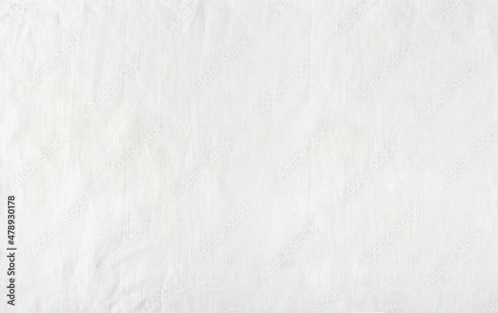 White linen fabric background.