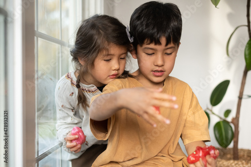 Kids handling slime