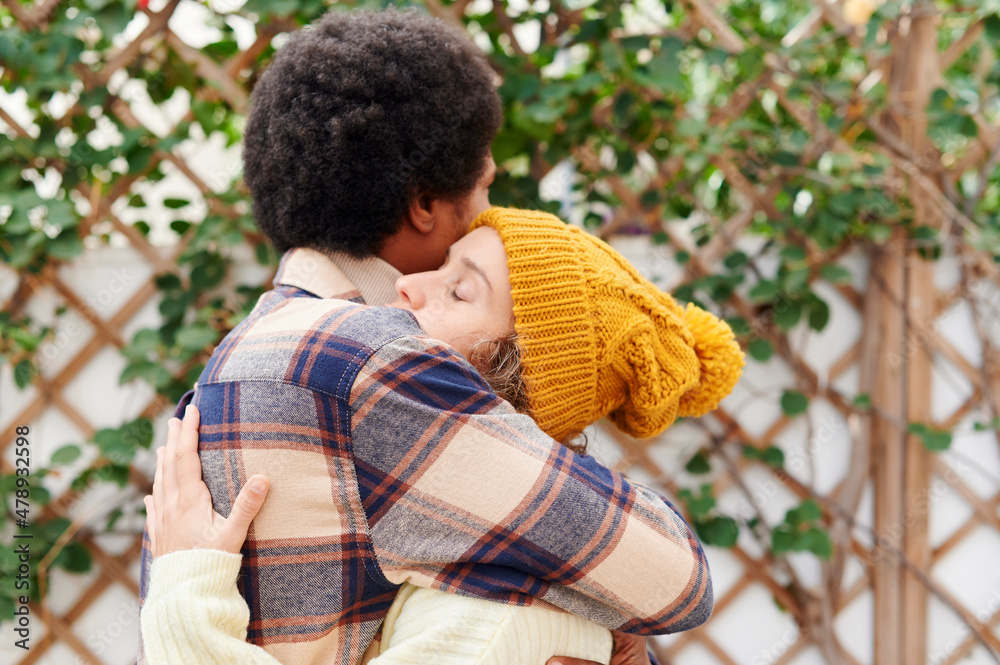 Young couple hugging outside in autumn Young couple hugging outside in autumn