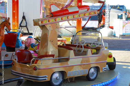 car with missile on a merry-go-round
 photo