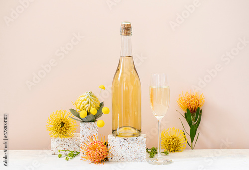 Champagne bottle still life with flowers photo