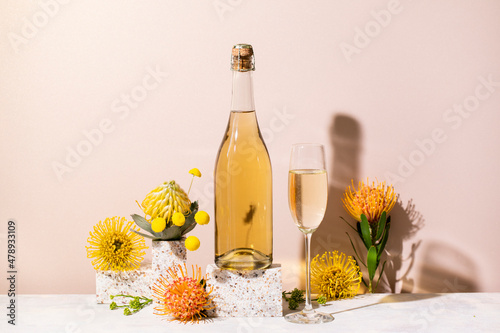 Champagne bottle still life with flowers