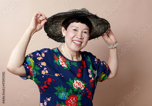 Asian woman in joyful mood indoors
