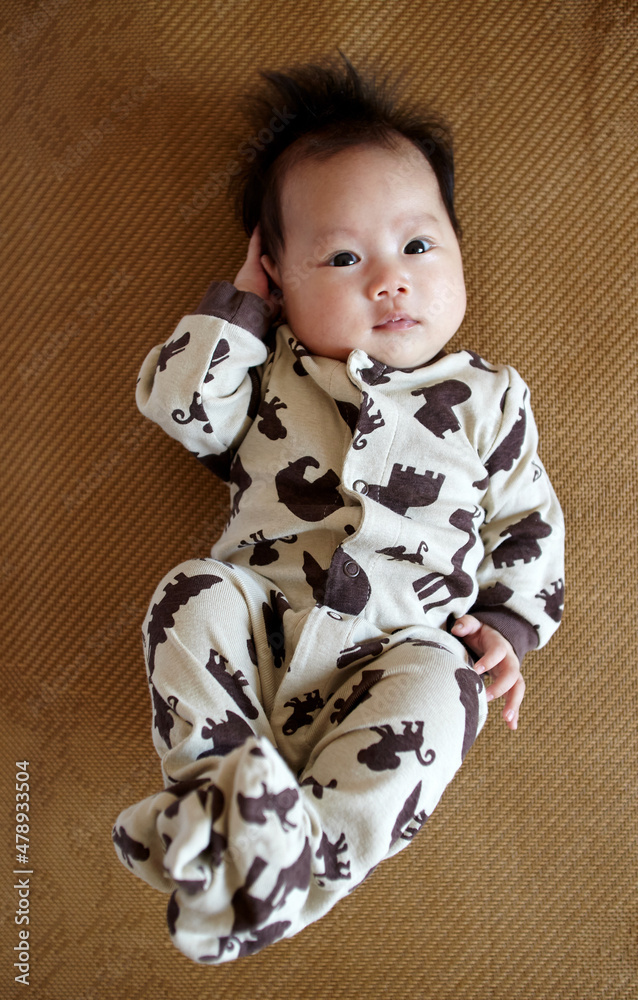Asian newborn baby making funny expressions Asian newborn baby making funny expressions