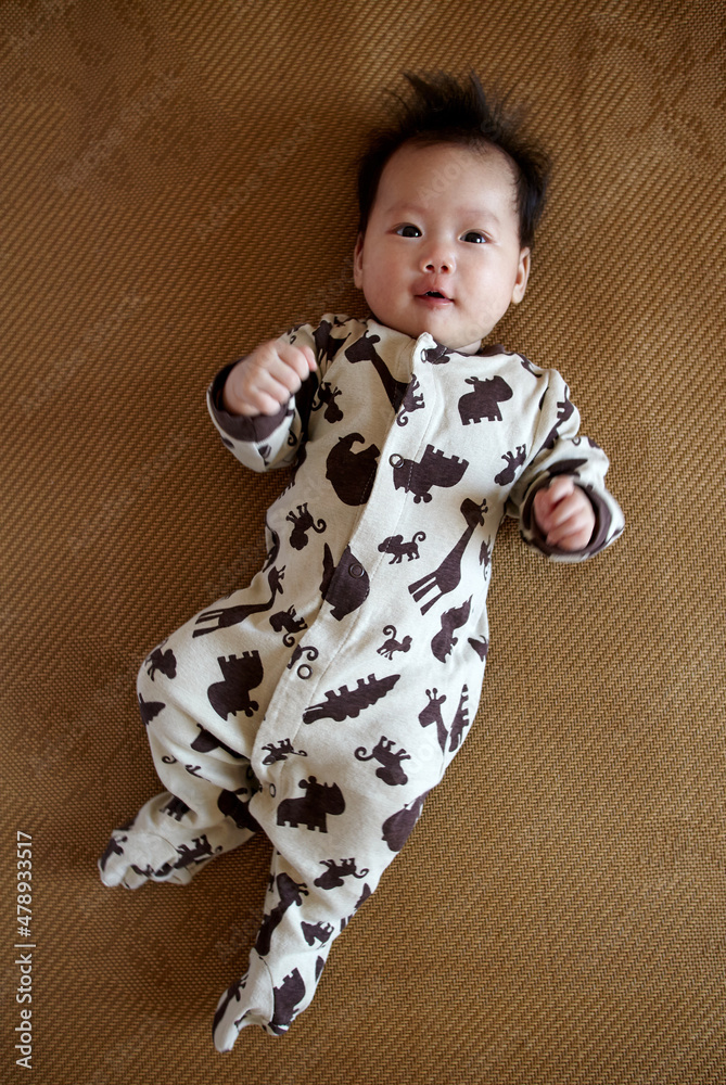 Asian newborn baby making funny expressions Asian newborn baby making funny expressions