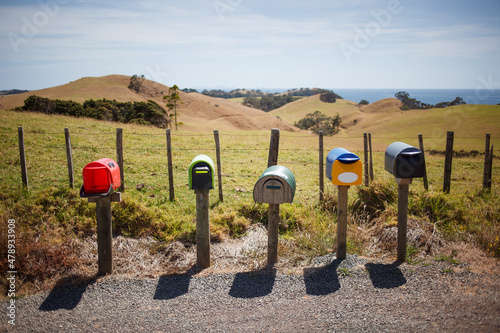 Colorful letterboxes on a rural road photo