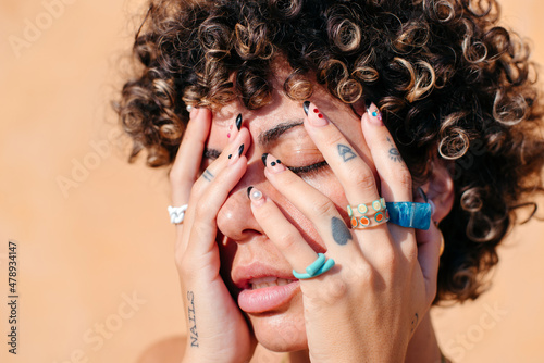 Colorful jewelry and nails photo