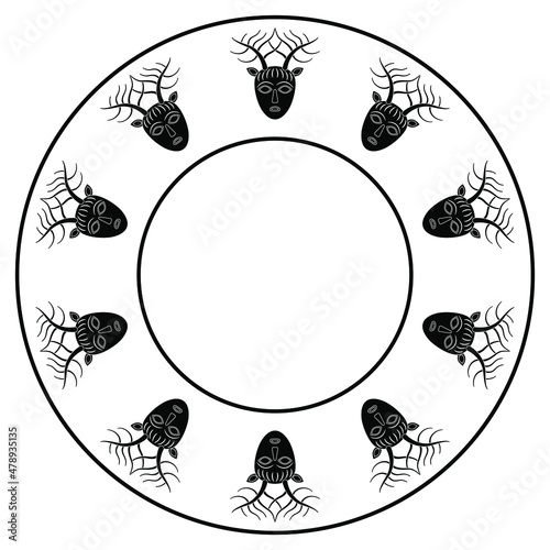 Round ethnic frame with heads of Celtic god Cernunnos. Horned human head with deer antlers. Black and white silhouetted circular ornament.