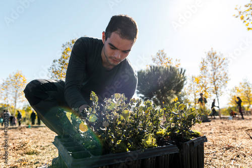 Volunteer gardener planting trees