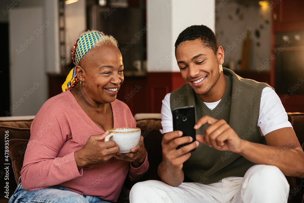 Mother and son using smartphone together