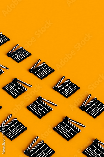 movie slates on orange background. 3d render  photo