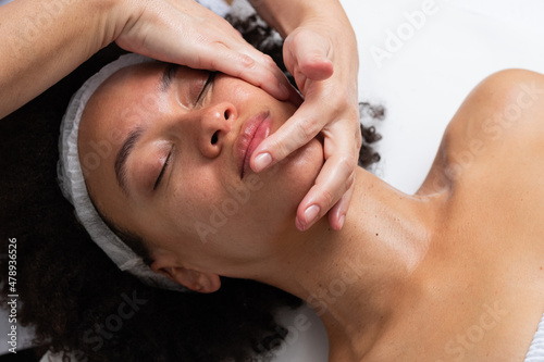 Woman Having A Facial Massage Close Up photo