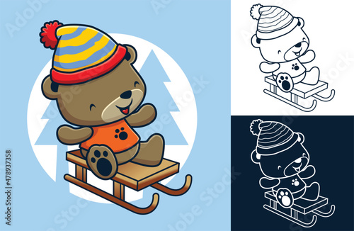 Cute bear wearing winter hat rides on sledge