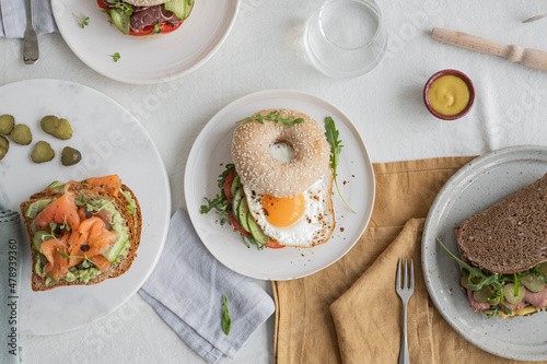 Diferents sandwichs and bagels on the style table. photo