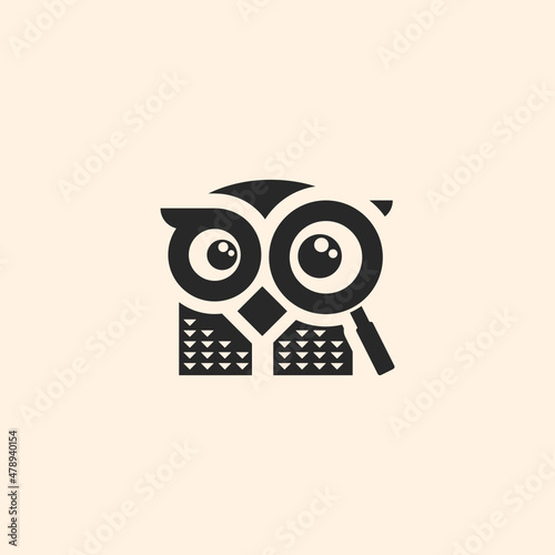 Owl with magnifying glass silhouette logo photo