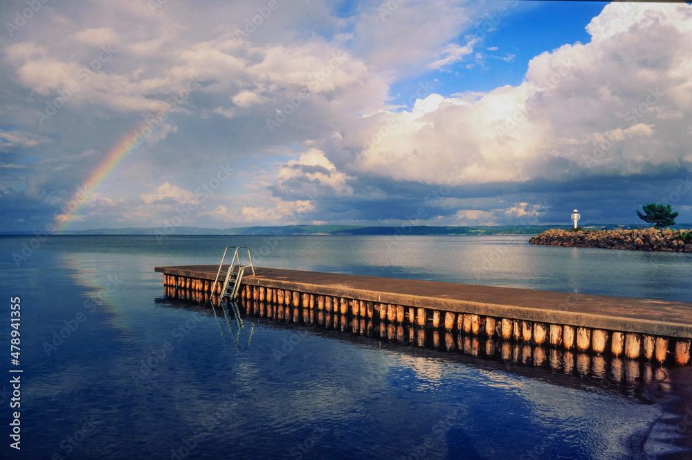 rainbow at lake vaettern near habo in sweden