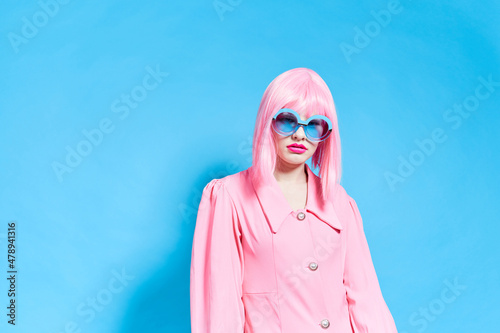 glamorous woman in pink dress wig bright makeup