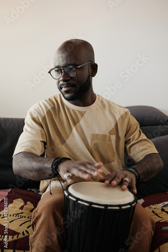 Young Man Playing Djembe photo