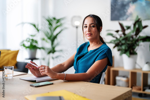 Smiling woman working in modern office