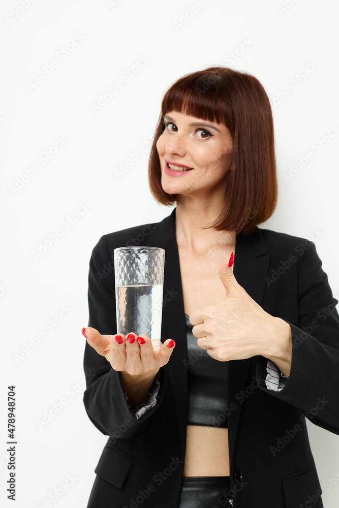 beautiful woman black jacket transparent glass with water Lifestyle unaltered beautiful woman black jacket transparent glass with water Lifestyle unaltered