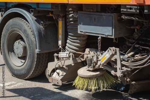 The sweeper sweeps and washes the streets in the city.