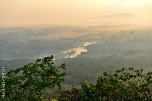 Sunrise over the Lampang city  Bird eye view on Wat Phra That Doi Phra Chan. Lampang Thailand.  