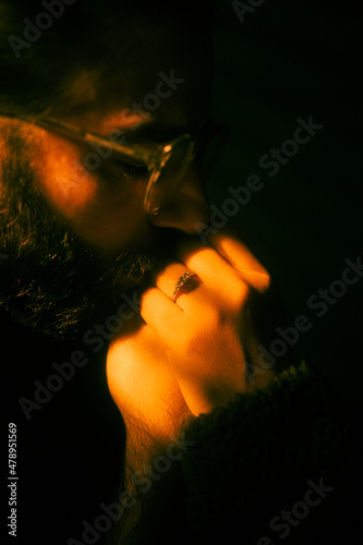 Man kissing woman's hand.