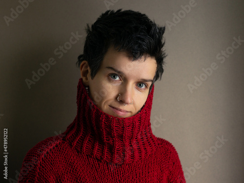Portrait of a young woman in a red sweater