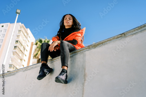 Stylish woman in skate park