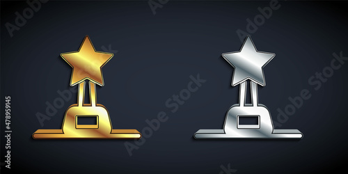 Gold and silver Movie trophy icon isolated on black background. Academy award icon. Films and cinema symbol. Long shadow style. Vector