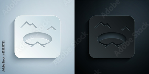 Paper cut Winter fishing icon isolated on grey and black background. Round ice frame. Hole in ice. Paper art style. Vector