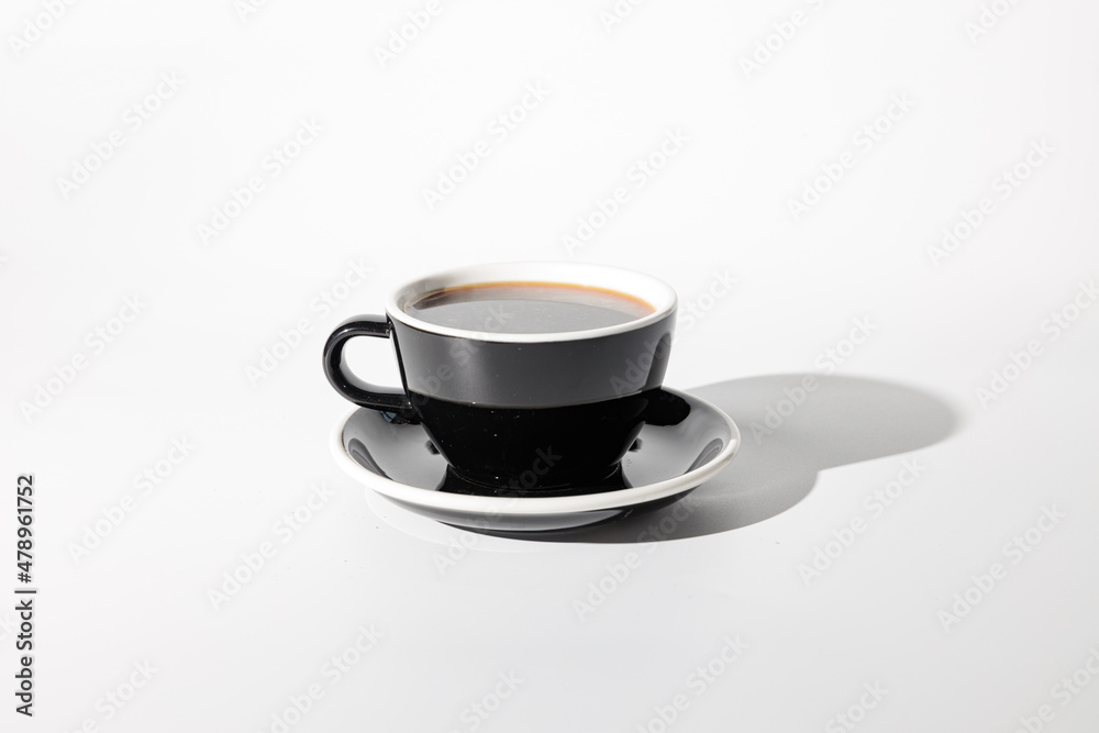 Close up of beverage in black cup with sauce Close up of beverage in black cup with sauce