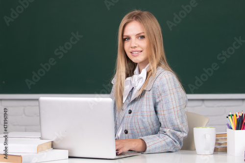 Female cute blonde female student in university, school education, Young woman study in college classroom.
