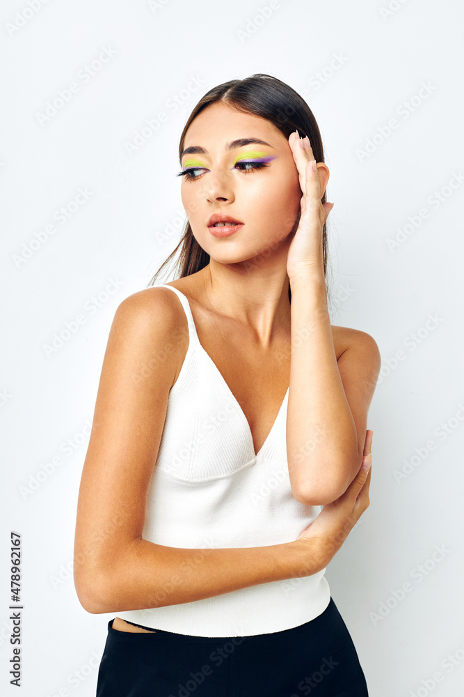 young woman attractive look fashion posing light background unaltered young woman attractive look fashion posing light background unaltered