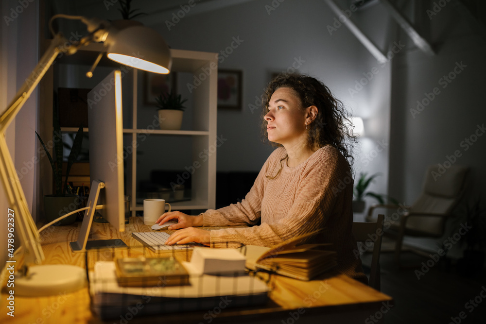 College woman studying at home during night College woman studying at home during night