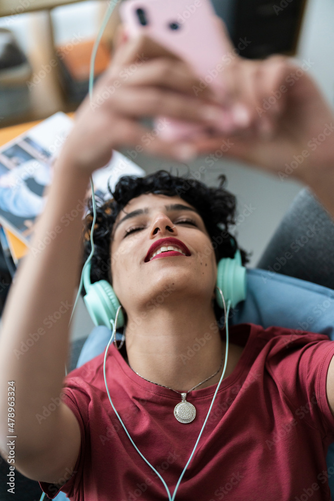 Woman enjoying music in headphones Woman enjoying music in headphones