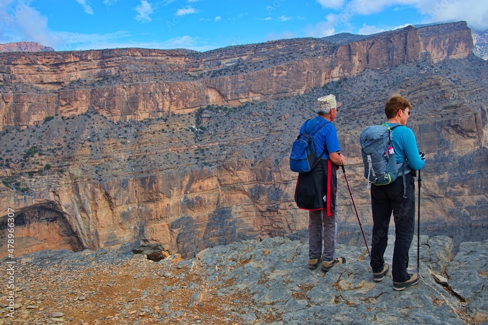 Senior couple standing at the edge of canyon