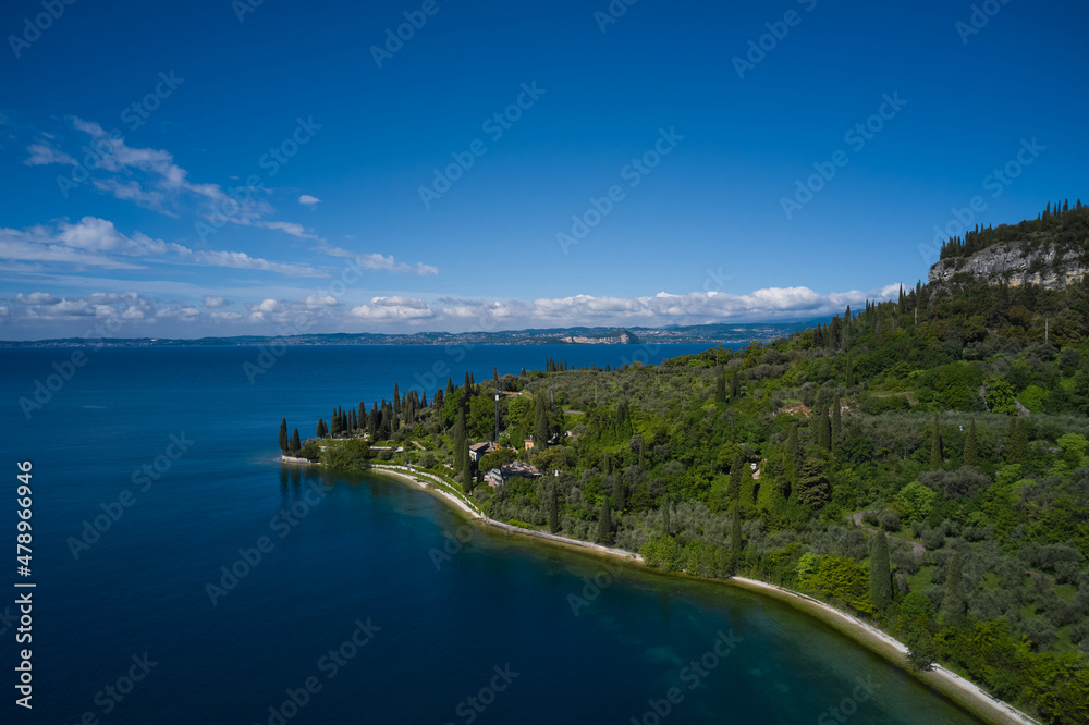 Panorama of punta san vigilio. Aerial view of Parco Baia delle Sirene, Lake Garda, Italy. Top view of baia delle sirene on the coastline of Lake Garda.