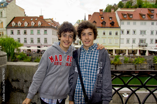 handsome twins smiling at camera in ljubljana, slovenia