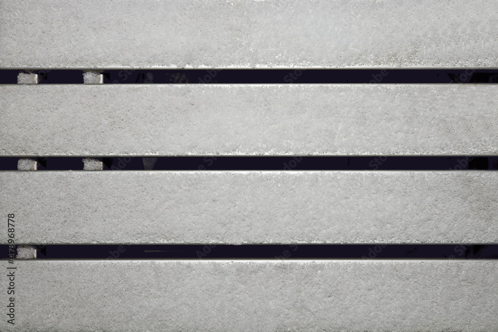 Fototapeta premium Winter and snow. Wooden boards and trunks covered with snow and ice as a base and background. Close-up.