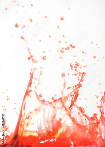 Red water splash, isolated on white background.