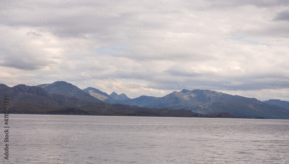 View accross the water at Armadale towards the mountains of the mainland, Armadale, Isle of Skye, Scotland, uk