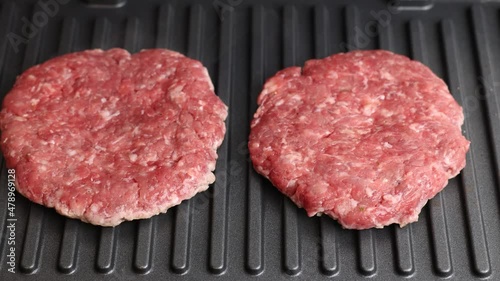 The cutlets are grilled. Ground beef cutlets are grilled close-up.
