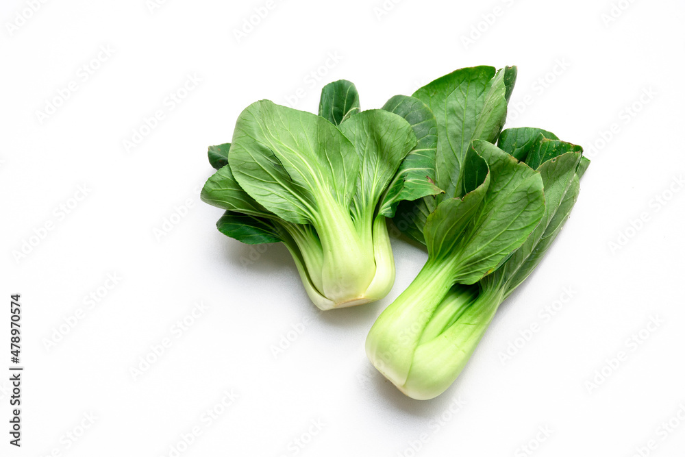 Two Chinese mustard green are on a white background. Two Chinese mustard green are on a white background.