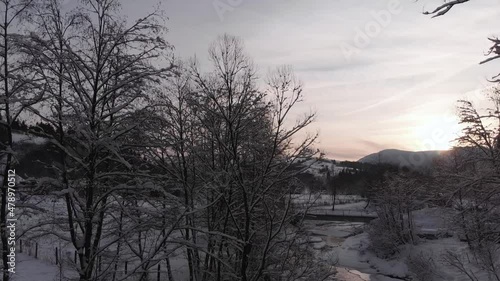 Winter in the mountains. Forest in the snow. Shooting from a quadcopter.