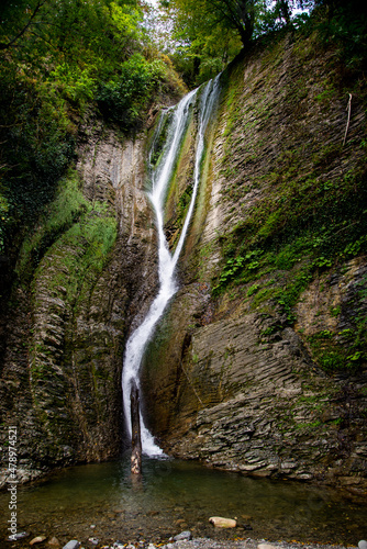  A beautiful waterfall in the Krasnodar Territory. The majestic landscape of the waterfall.