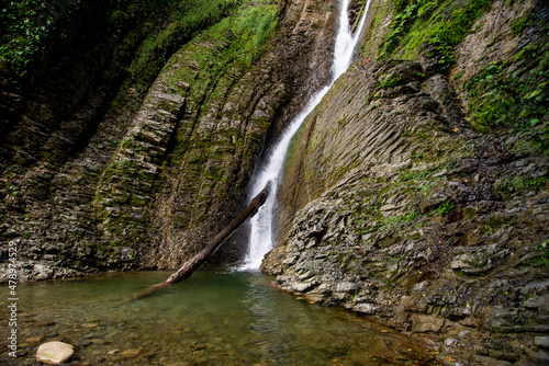 
A beautiful waterfall in the Krasnodar Territory. The majestic landscape of the waterfall.