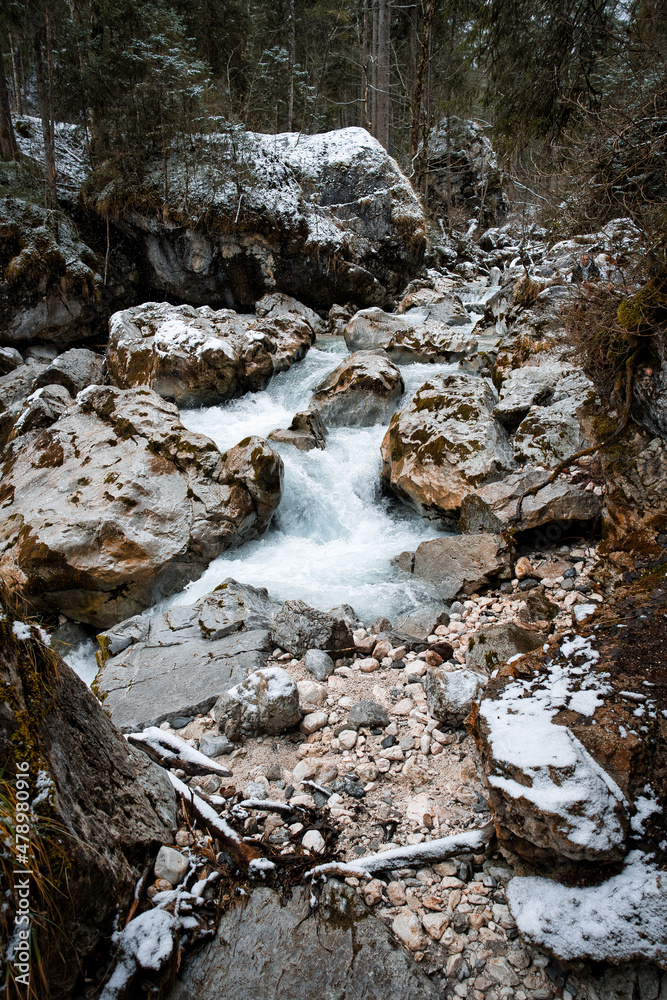 Stormy river in the magic forest with rocks / stones - Ramsau Hintersee Stormy river in the magic forest with rocks / stones - Ramsau Hintersee